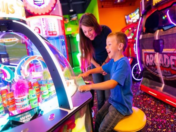 Mother and son playing an arcade game in the FunZone
